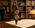 Beaded Bookmark - Black standing upright on a book in a study