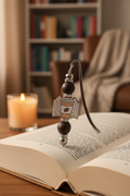 Silver beaded bookmark in cozy reading nook setting