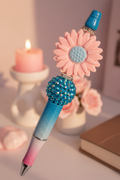 Pink flower beaded pen in bright cheerful home setting