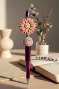 Mauve flower beaded pen in soft sophisticated home setting