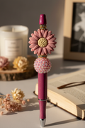 Mauve flower beaded pen in soft sophisticated home setting