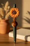 Terracotta-orange flower beaded pen in warm earthy home setting
