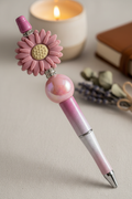 Mauve flower beaded pen in soft sophisticated home setting