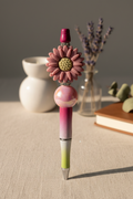 Mauve flower beaded pen in soft sophisticated home setting