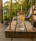 20oz Floral Tumbler with ice water and lemon slice on rustic porch swing