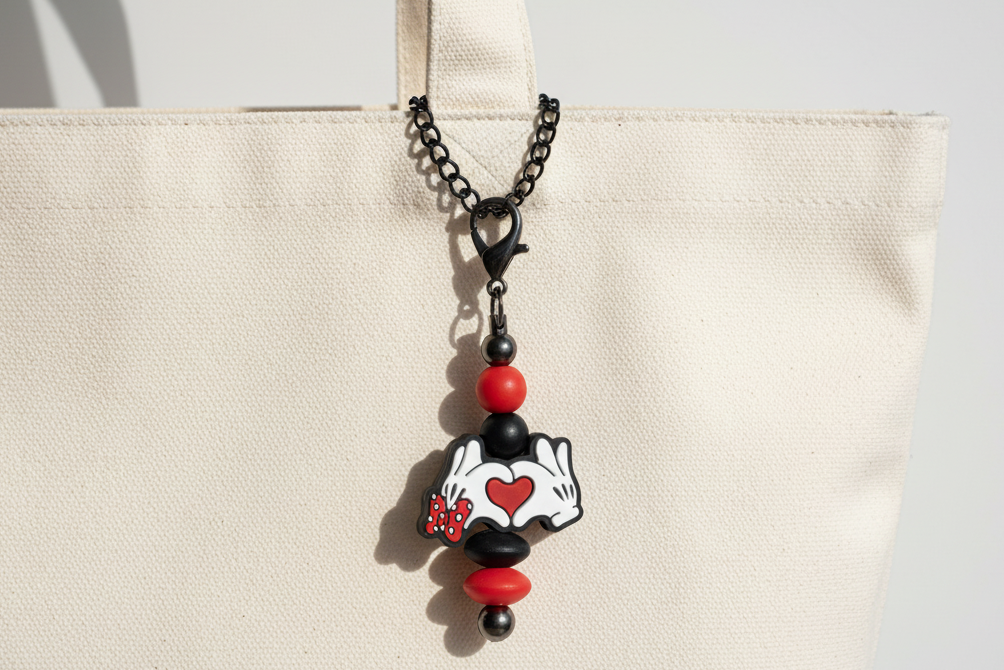 Beaded charm on white bag