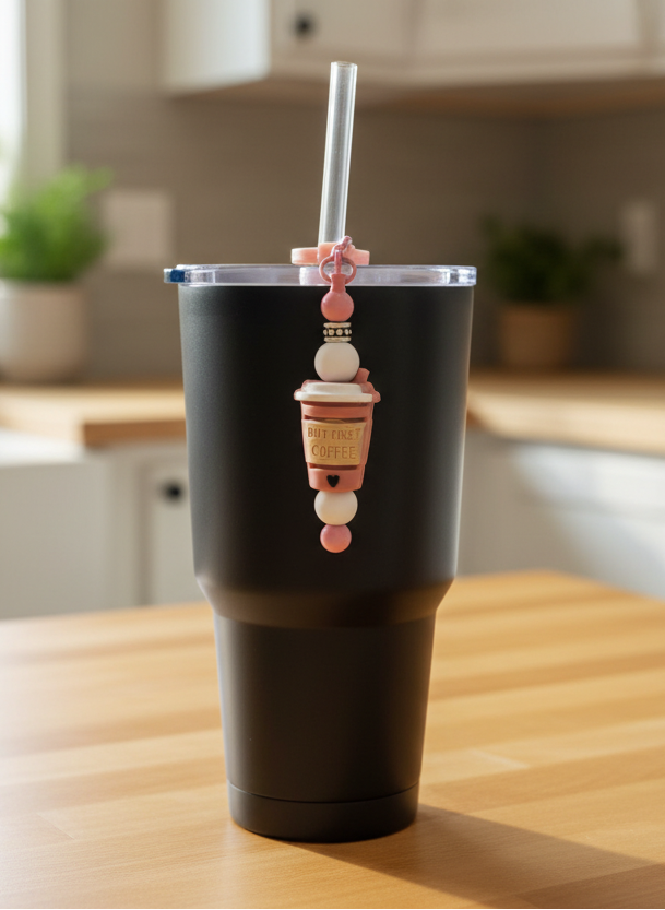 Beaded straw charm on black tumbler on kitchen counter
