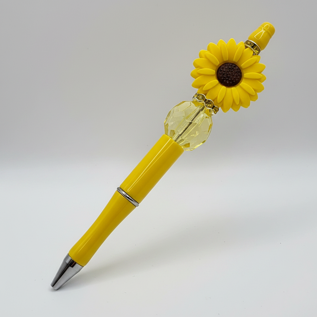 Yellow flower beaded pen clean product shot on white background